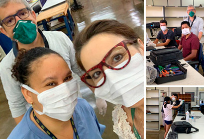 Voluntários atuam em diversas frentes de trabalho na Universidade pessoas com máscaras realizam testes em computadores dispostos na mesa