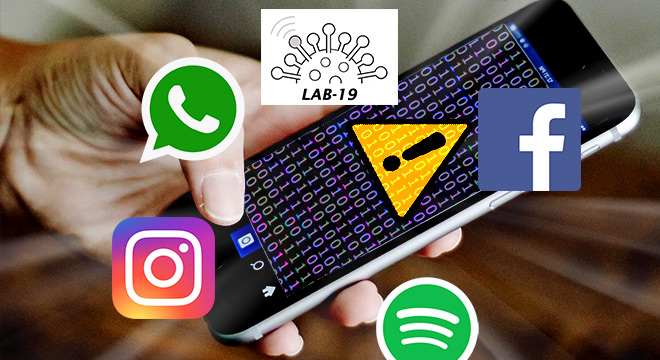 Audiodescrição: foto colorida, em foco mão segura um celular, no celular números binários e um triângulo amarelo com uma exclamação, acima e ao lado ícones do Lab-19, Facebook, Instagram, Whatsapp e Spotify