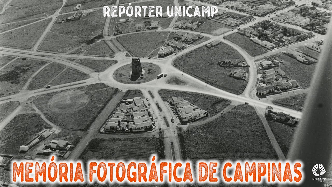 Capa do programa tem uma foto aérea antiga em preto e branco, mostrando a região do Castelo, na cidade de Campinas. Está escrito em letras da cor laranja a frase "memória fotográfica de Campinas". Na parte de cima aparece o nome do programa "Repórter Unicamp"