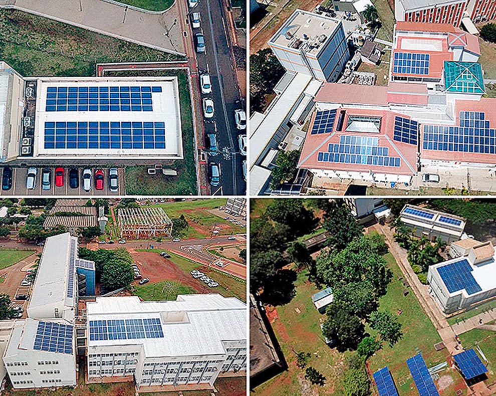 foto mostra prédios da Unicamp com placas de geração de energia fotovoltaica