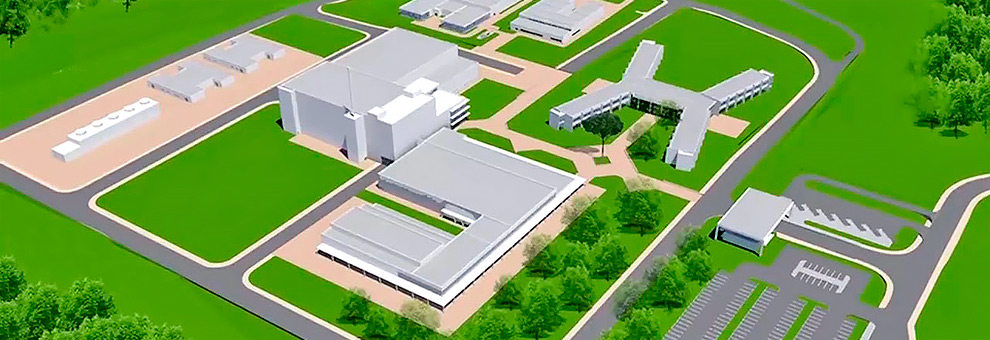 O Reator Multipropósito Brasileiro (RMB), já em construção no Centro Industrial Nuclear de Aramar (CINA), em Iperó Audiodescrição: ilustração simplificada que simula imagem aérea de um centro industrial nuclear, com várias edificações distribuídas em meio a espaços verde, formando quarteirões. Ao centro da imagem, fica a edificação principal, com alguns andares e torre com antena. Logo à frente, outra edificação, mais ampla, retangular e apenas com andar térreo. Há ruas asfaltadas no entorno do quarteirão e ao centro. À direita na imagem, há a portaria que dá acesso ao local. Imagem 1 de 1.